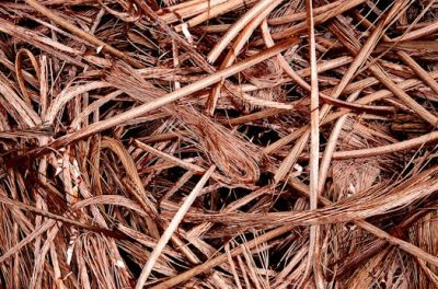pexels-photo-5279317-5279317 Close-up view of intertwined copper wires ready for recycling, emphasizing industrial reuse.